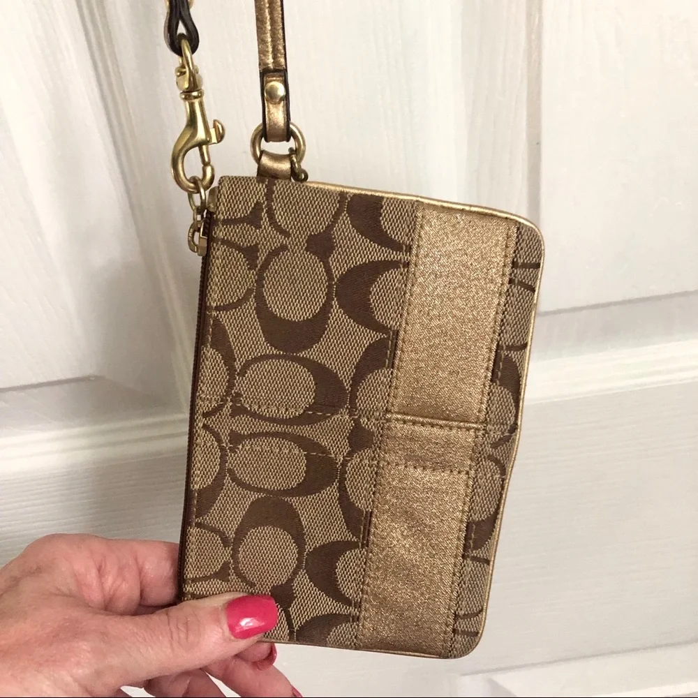 Coach signature tan wristlet, gold strap & stripe